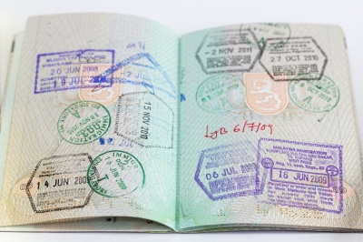Passport open to pages with multiple visa stamps, image courtesy of Tuomas Lehtinen at freedigitalphotos.net