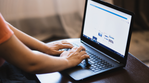 Lentini Visas | Immigration Services, Law Office of Jacqueline Lentini LLC | Department of State Expands Social Media Screening to Additional Visa Categories A person types on a laptop computer with their hands on the keyboard. The image shows someone working at their desk.