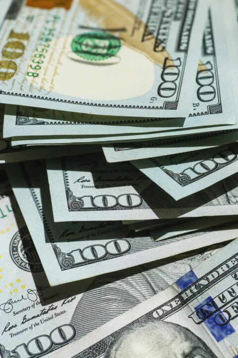 Piles of US hundred-dollar bills